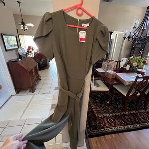 Brand new Army Green jumpsuit by Calvin Klein with pockets and belt tie.